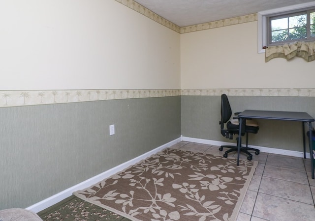 office space featuring wainscoting and tile patterned floors