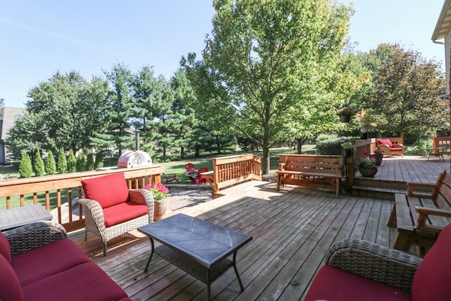 wooden terrace with an outdoor hangout area