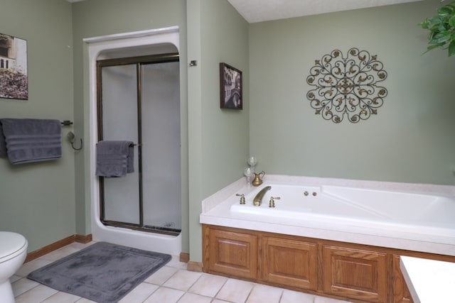 full bath featuring toilet, a garden tub, a shower stall, and tile patterned flooring