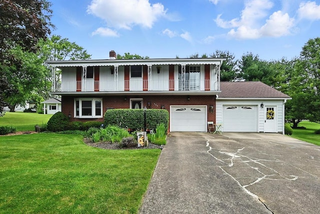 155 W Smiley Ave, Shelby, OH 44875 - view of front facade featuring a balcony, brick siding, a front lawn, asphalt driveway, and a chimney