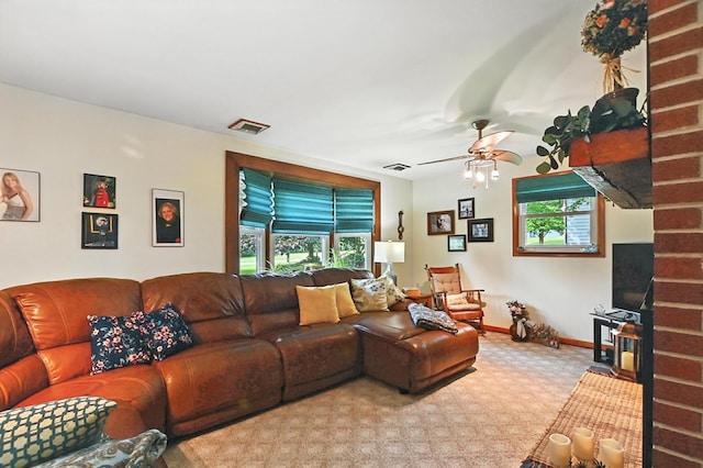155 W Smiley Ave, Shelby, OH 44875 - living room featuring healthy amount of natural light, carpet floors, ceiling fan, and a wood stove