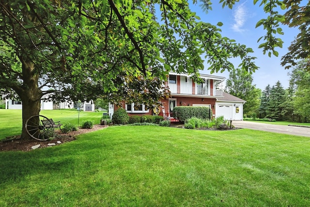 155 W Smiley Ave, Shelby, OH 44875 - view of front of property featuring driveway, brick siding, and a front yard