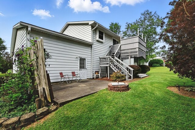 155 W Smiley Ave, Shelby, OH 44875 - back of house with a fire pit, stairway, a patio, a deck, and a lawn