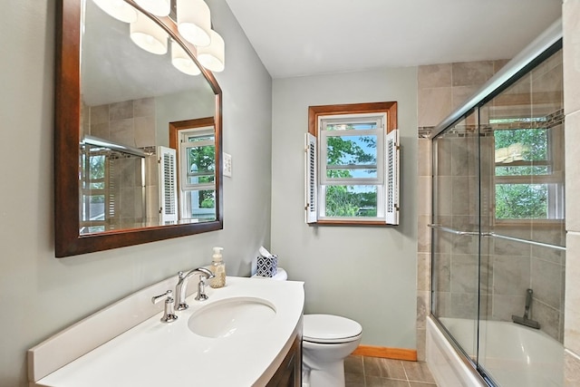 155 W Smiley Ave, Shelby, OH 44875 - bathroom with healthy amount of natural light, vanity, tiled shower / bath, and tile patterned flooring