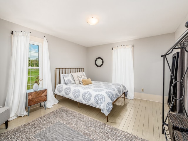 bedroom with hardwood / wood-style flooring