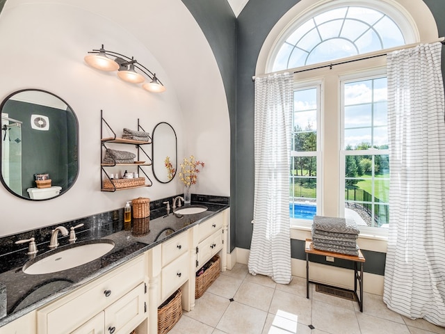 bathroom featuring tile patterned flooring and vanity