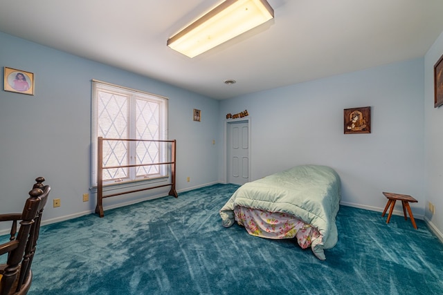 bedroom featuring dark colored carpet