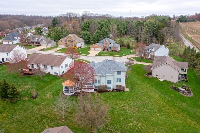 bird's eye view with a residential view and a wooded view
