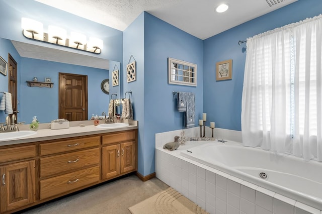 full bath featuring double vanity, a sink, and a bath