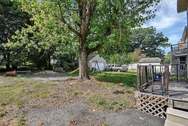 view of yard with an outbuilding and a deck