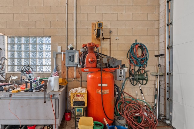 garage with concrete block wall
