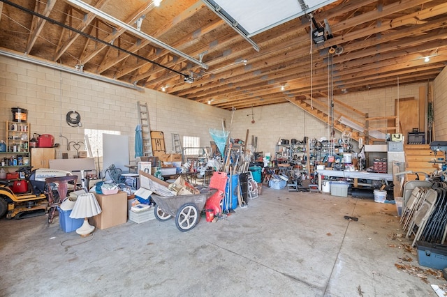 garage featuring a workshop area and a garage door opener