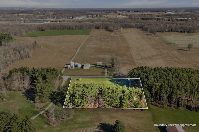 birds eye view of property featuring a rural view