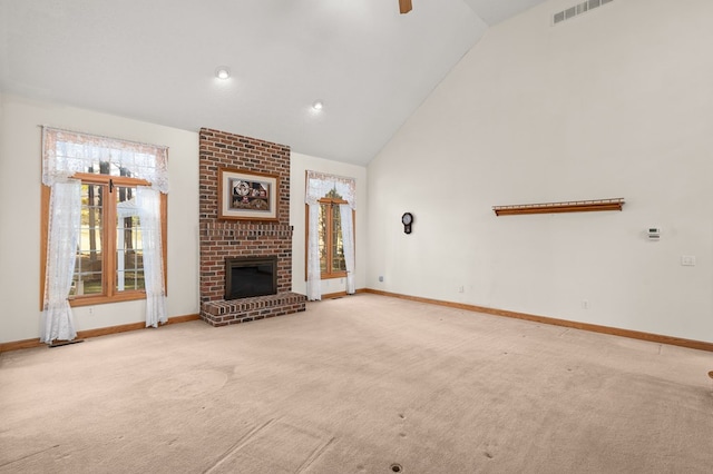 unfurnished living room with high vaulted ceiling, visible vents, baseboards, a fireplace, and carpet floors