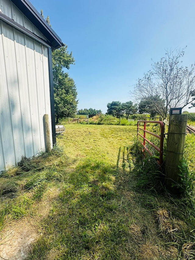 view of yard with a rural view