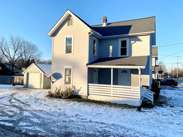 view of front of property featuring covered porch and a garage