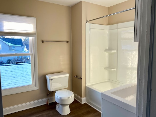 bathroom featuring shower / tub combination, toilet, and hardwood / wood-style flooring