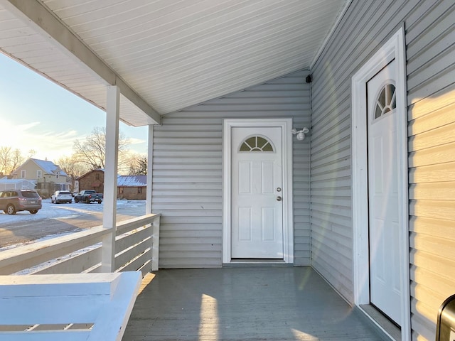 doorway to property featuring covered porch