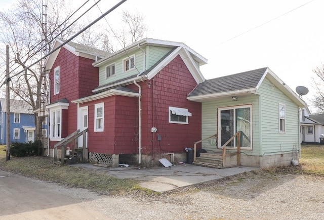 214 Park St, Willard, OH 44890 - view of front of home featuring a shingled roof and entry steps