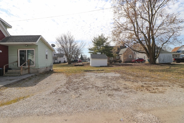 214 Park St, Willard, OH 44890 - view of yard with a storage unit and an outdoor structure