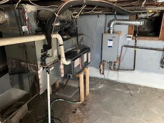 utility room featuring water heater