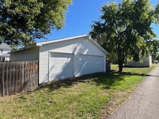 garage featuring a lawn