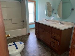 full bathroom featuring vanity, shower / bathtub combination, and toilet