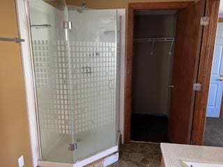 bathroom with vanity and walk in shower