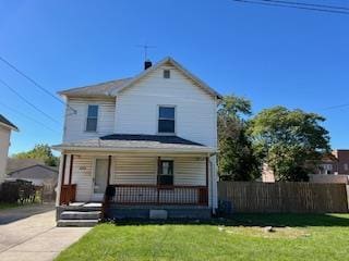 view of front property with a porch and a front lawn