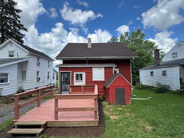 3 Eastlawn Ave, Mansfield, OH 44905 - rear view of property featuring a lawn, a wooden deck, a storage shed, and a chimney