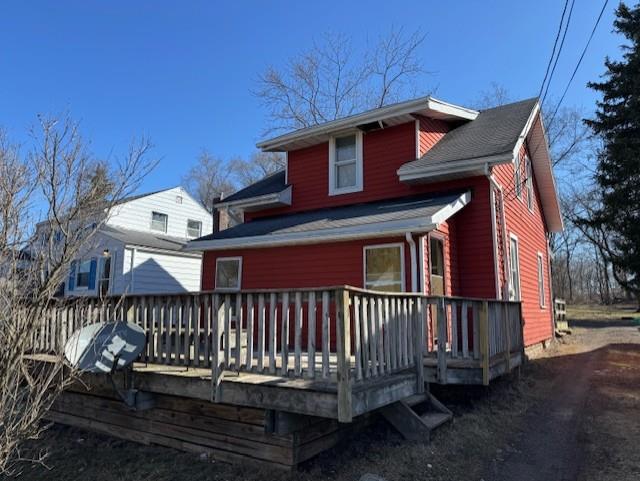 back of property featuring a deck