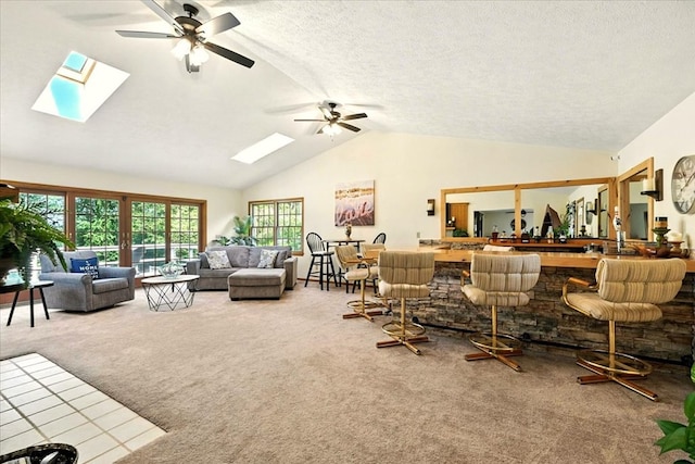 415 Lakeshore Rd, Ashland, OH 44805 - carpeted living area featuring a skylight, lofted ceiling, and a ceiling fan