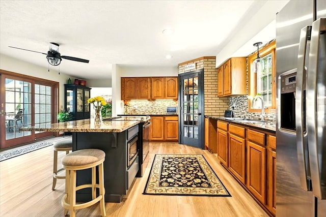 415 Lakeshore Rd, Ashland, OH 44805 - kitchen with stainless steel fridge, electric range oven, plenty of natural light, light wood finished floors, and recessed lighting