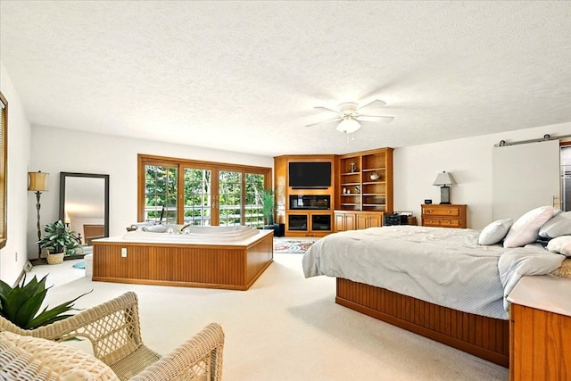 415 Lakeshore Rd, Ashland, OH 44805 - carpeted bedroom with a barn door, a textured ceiling, and ceiling fan