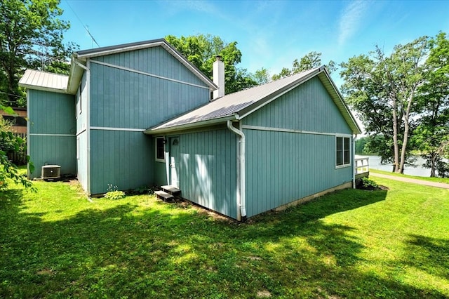 415 Lakeshore Rd, Ashland, OH 44805 - view of property exterior featuring a yard, a metal roof, and a chimney
