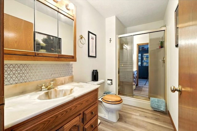 415 Lakeshore Rd, Ashland, OH 44805 - full bath with wood finished floors, vanity, tasteful backsplash, and a shower stall