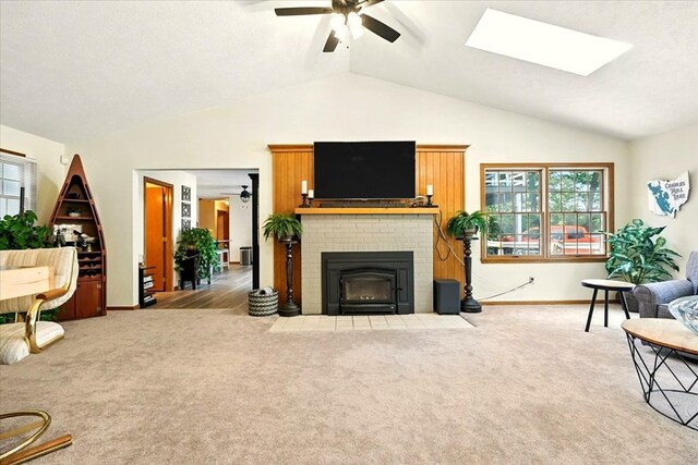 415 Lakeshore Rd, Ashland, OH 44805 - living room with ceiling fan, lofted ceiling, carpet flooring, a brick fireplace, and a skylight