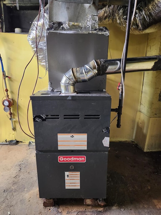 utility room featuring heating unit