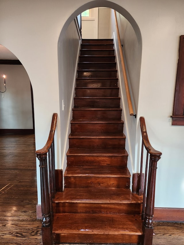 stairs with hardwood / wood-style flooring