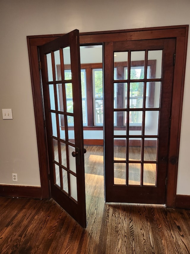 entryway featuring dark hardwood / wood-style floors and french doors