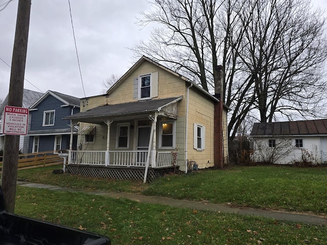 bungalow-style house featuring a porch and a front yard