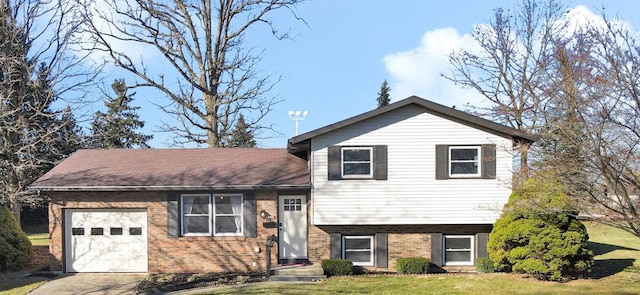 split level home with a garage and a front yard