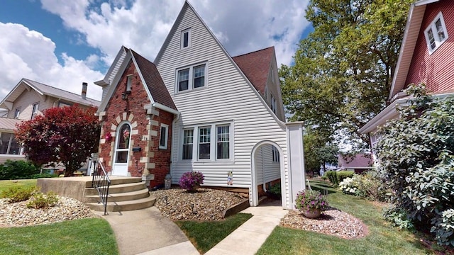 528 Maplewood St, Willard, OH 44890 - tudor home featuring roof with shingles
