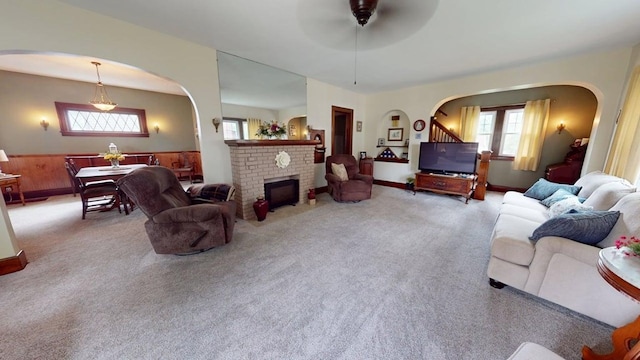 528 Maplewood St, Willard, OH 44890 - living room with carpet, arched walkways, and ceiling fan