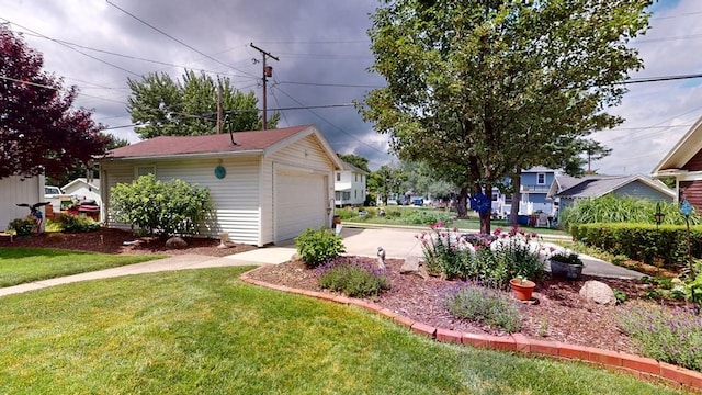 528 Maplewood St, Willard, OH 44890 - view of grassy yard with a garage, an outdoor structure, and driveway