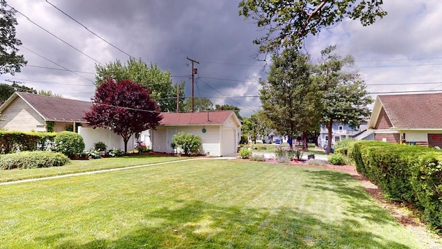 528 Maplewood St, Willard, OH 44890 - view of green lawn featuring a garage