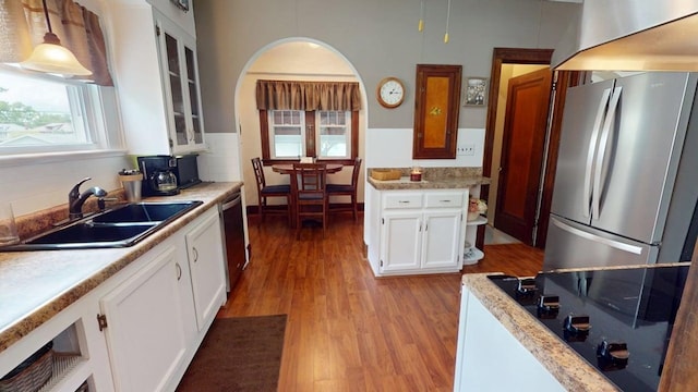 528 Maplewood St, Willard, OH 44890 - kitchen with stainless steel appliances, light wood-style floors, white cabinets, and light countertops