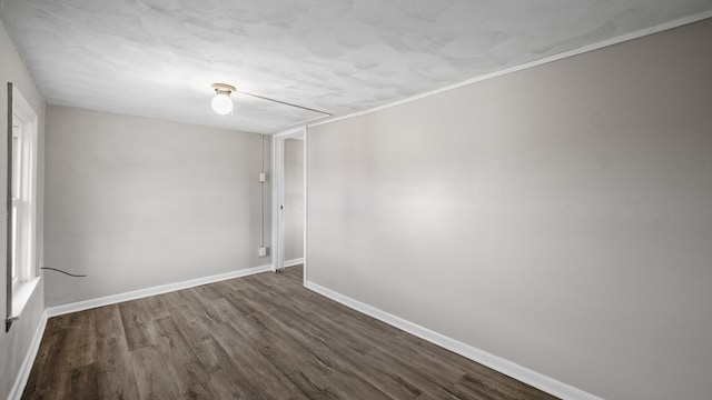 spare room featuring dark hardwood / wood-style flooring