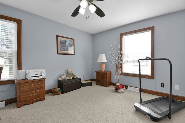 workout room featuring visible vents, plenty of natural light, baseboards, and carpet flooring