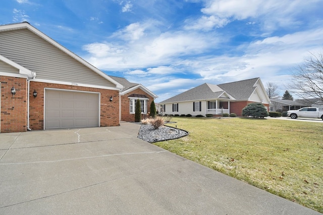 view of front of home with brick siding, driveway, an attached garage, and a front yard